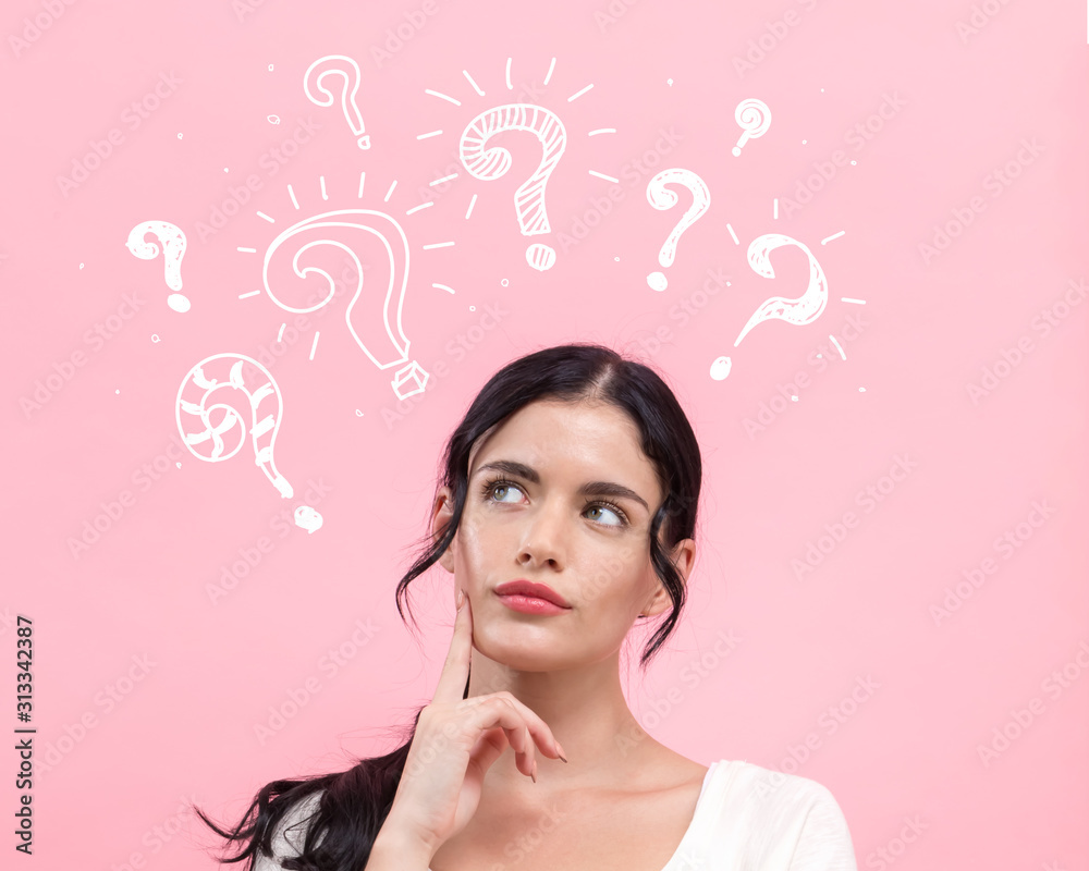 Question marks with young woman in thoughtful pose Question marks with young woman in thoughtful pose