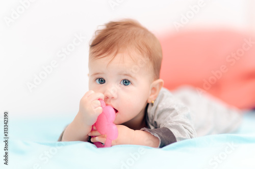 Cute Baby Biting on Calming Teething Toy 