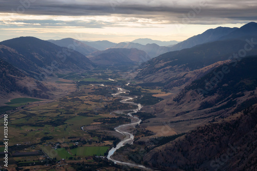 Aerial View of a Valley surrounded by Canadian Mountain Landscape and Farm Fields. Taken near Keremeos, British Columbia, Canada.