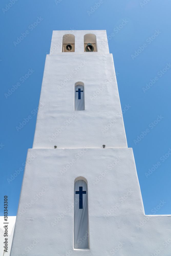 Tall white church bell tower.