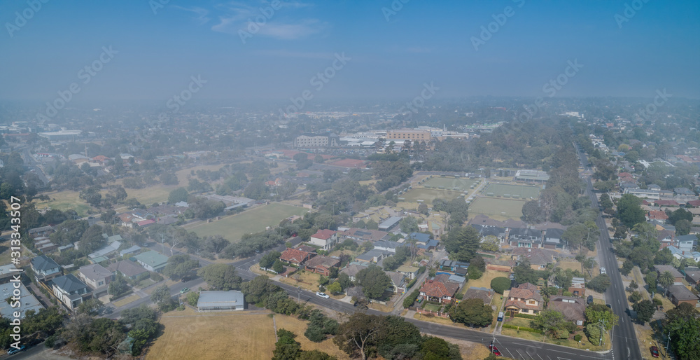 Residential areas of greater Melbourne under smoke haze from bush fires - aerial view