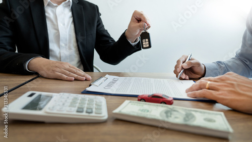 agent broker man holding document showing an transportation contract form to client ownership customer and salesman with car key.