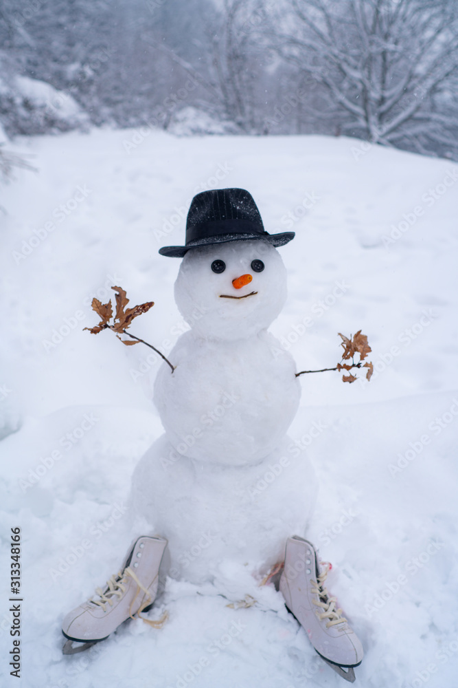 New Year greeting card. New year concept. Funny snowmen. Happy snowman with gift boxes standing in winter Christmas landscape.