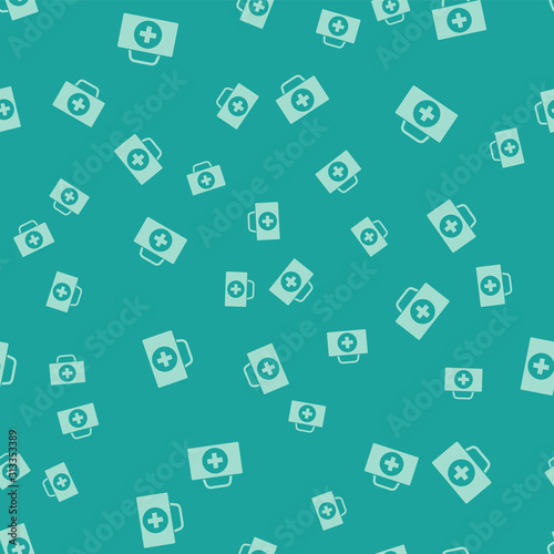 Green First aid kit icon isolated seamless pattern on green background. Medical box with cross. Medical equipment for emergency. Healthcare concept. Vector Illustration