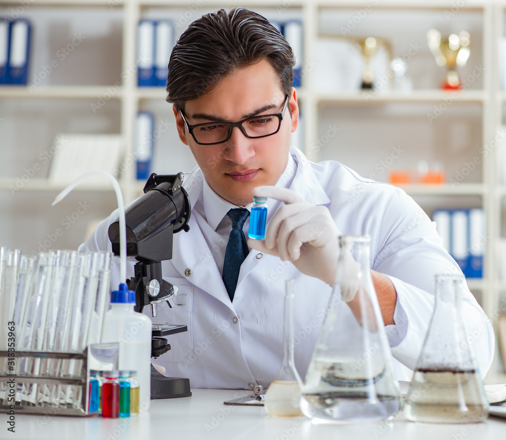 Young researcher scientist doing a water test contamination expe Young researcher scientist doing a water test contamination expe