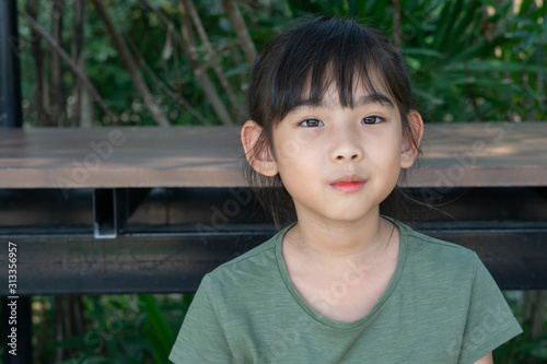 Portrait Asian cute little girl happy Green shirt