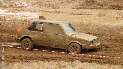 Fotografía Old European classic front wheel drive dirty racing car hatchback on off road ra