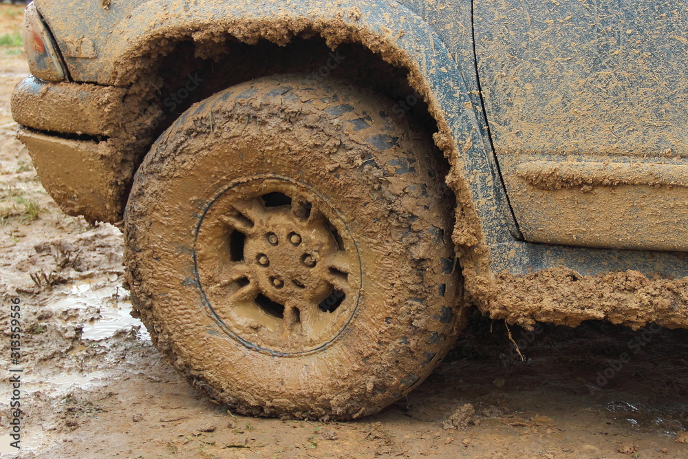 Dirty front wheel 4x4 truck close up Dirty front wheel 4x4 truck close up