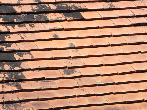  macro image of an old red tile roof in the sun