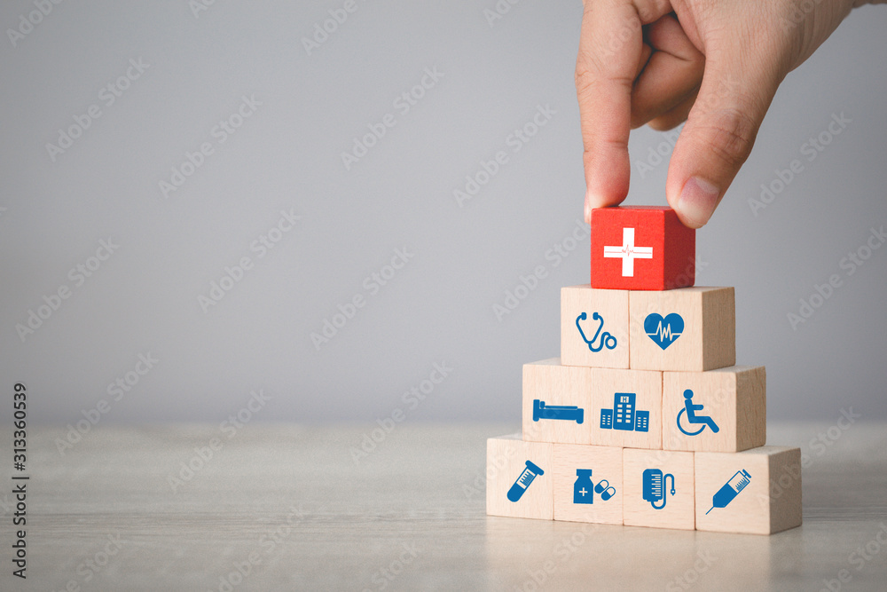Health Insurance Concept,hand arranging wood block stacking with icon healthcare medical. - obrazy, fototapety, plakaty 