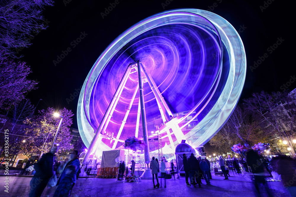 Ferris wheel at night at the fair in Granada.