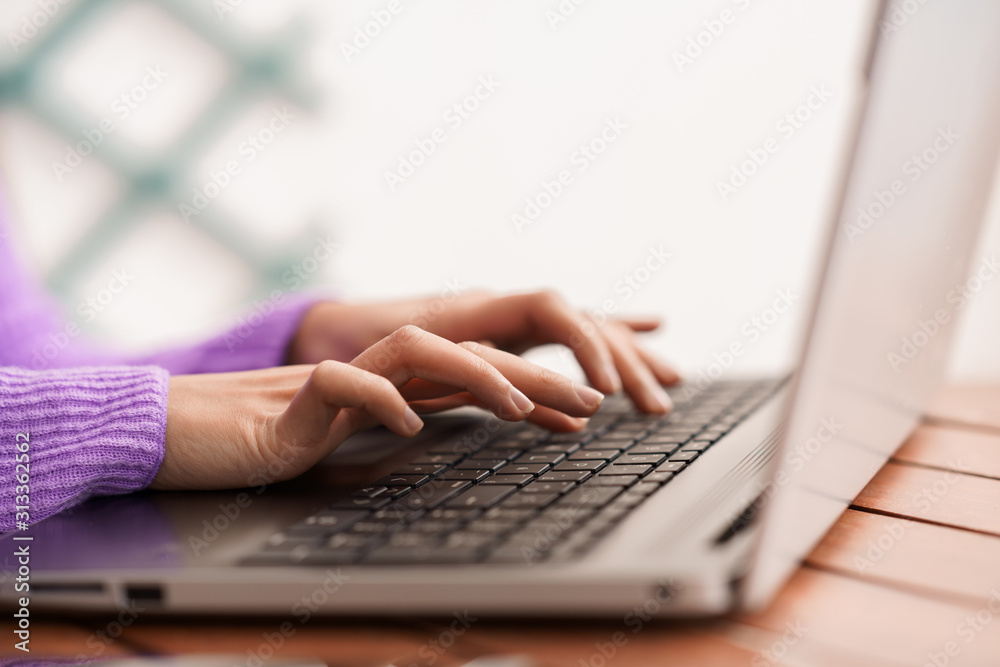 Persian woman on her balcony using laptop computer Persian woman on her balcony using laptop computer
