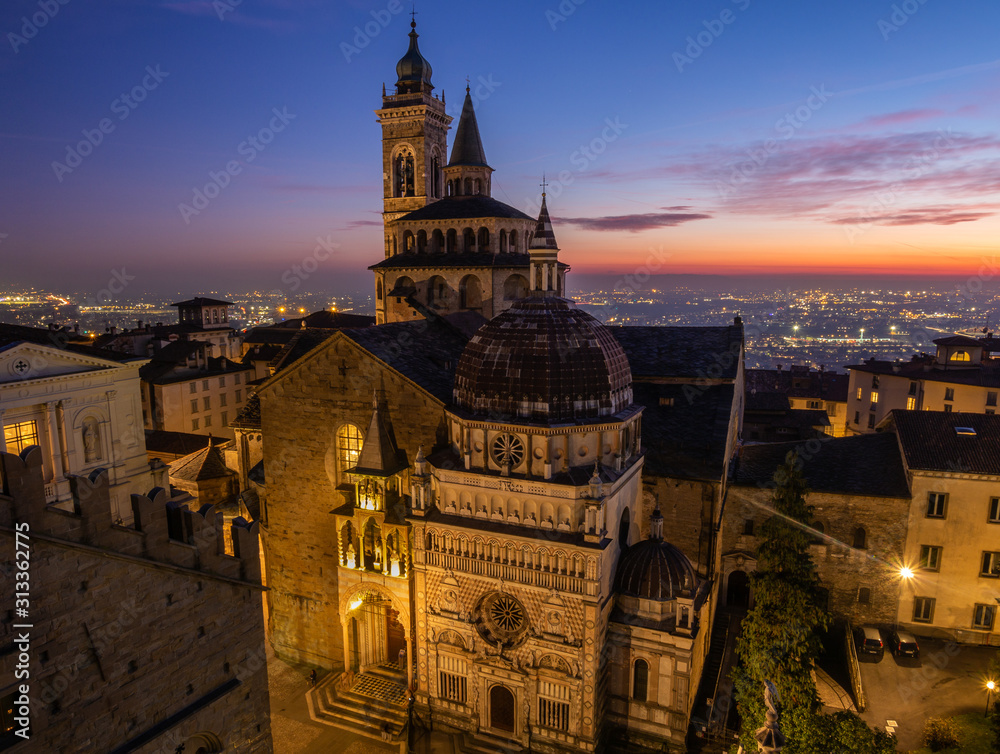 Bergamo, Italy. The old town. Amazing aerial view of the Basilica of Santa Maria Maggiore and the chapel Colleoni. Landscape of the city center and Its landmarks during a wonderful sunset