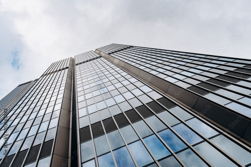 Fototapeta premium Blue skyscraper facade. office buildings. modern glass silhouettes