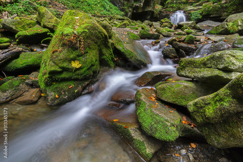 Autumn waterfalls with stones