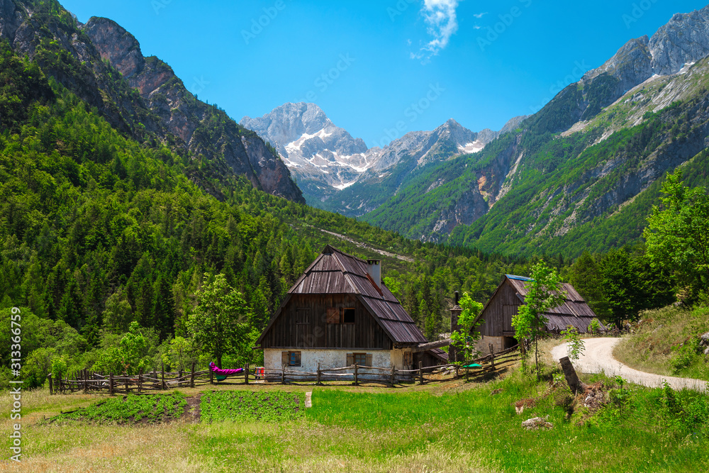 Stunning alpine landscape with rural houses in Soca valley, Slovenia