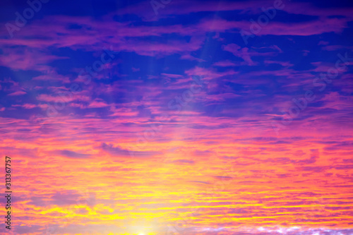 Romantic morning sky in bright and clear purple, pink, red and blue colors, winter sunrise, nature beauty color background