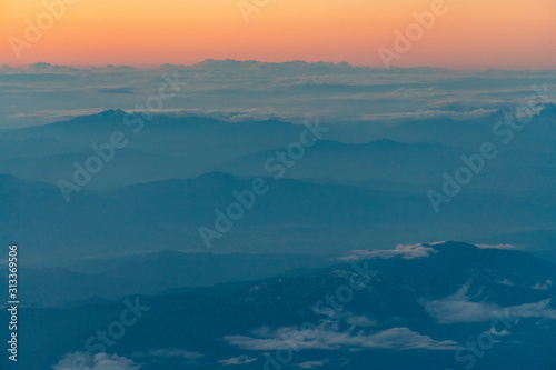aerial of cloud and mountain in the evening © sirfujiyama