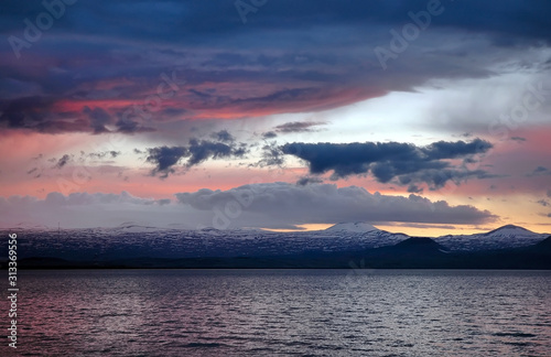Dramatic cloudy sunset above Sevan Lake. Armenia.