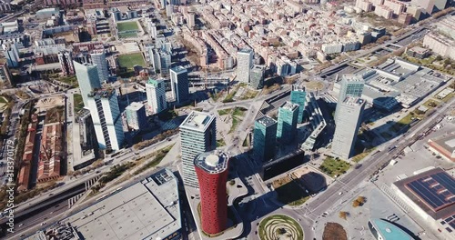 BARCELONA, SPAIN - MARCH 19, 2019: Aerial view of major business district Gran Via with Fira de Barcelona foreground and skyscrapers of Placa d Europa behind photo
