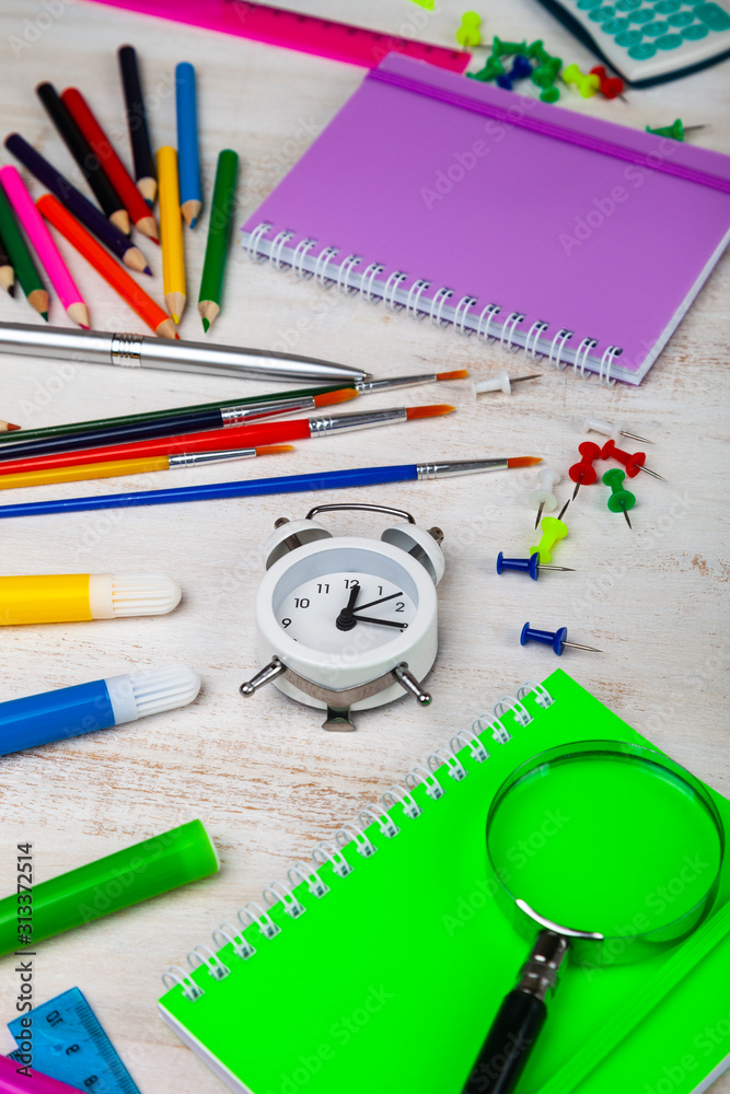 Items for the school on a wooden table. Items for the school on a wooden table.