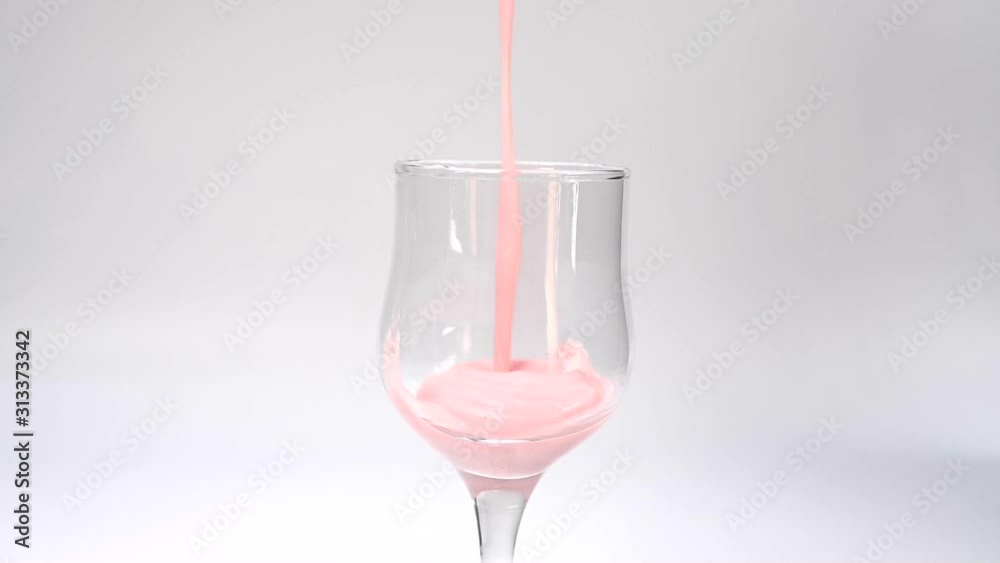 Pour strawberry juice into a healthy glass. Pour strawberry juice into a healthy glass.