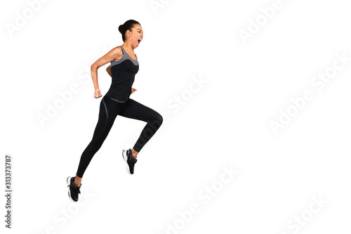 Fototapeta Naklejka Na Ścianę i Meble -  Emotional Afro Woman Jumping And Shouting During Workout, Studio