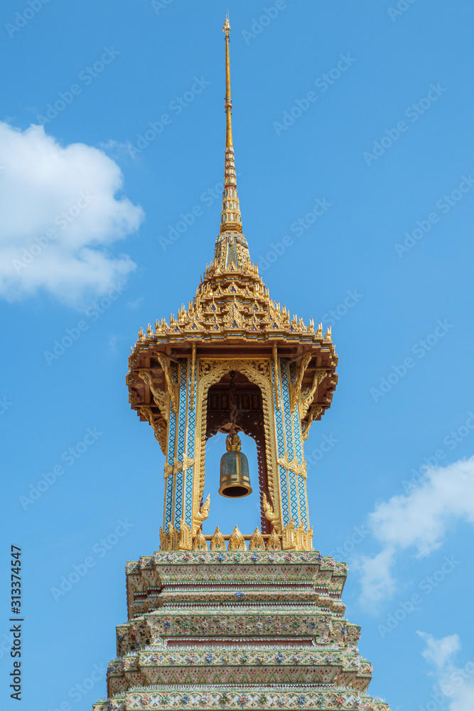 Fototapeta premium Golden bell tower in Grand Palace and Temple of The Emerald Buddha in Bangkok, Thailand. (Wat Phra Kaew)