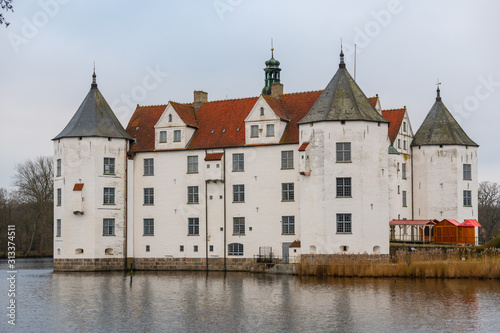 Glücksburg Castle from the side by the water and bad weather
