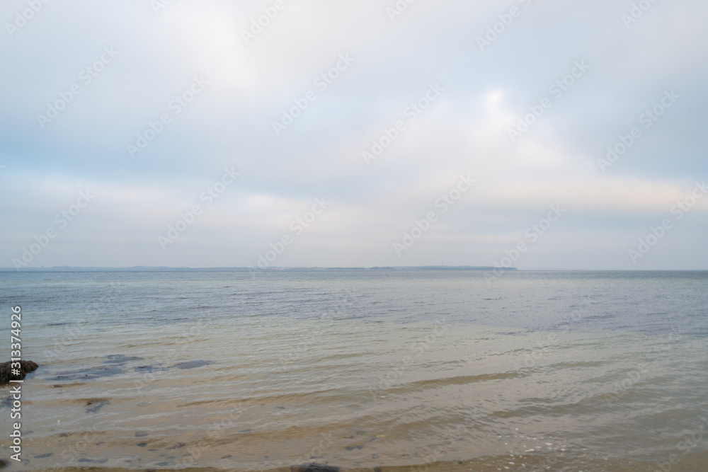Wonderful view of a beach with many stones on and in the water Wonderful view of a beach with many stones on and in the water