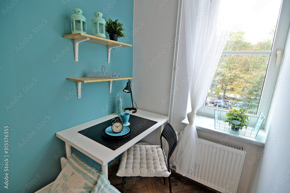 A teenager's room with a study desk.