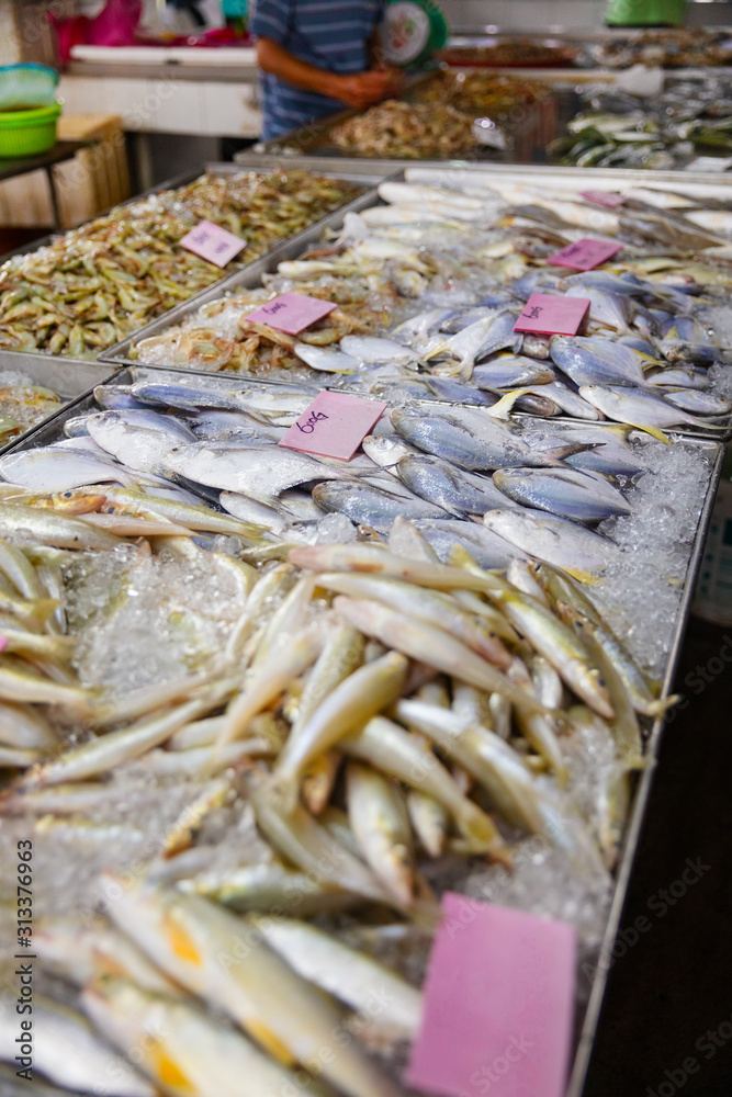 Various fresh fish on display at market stall Various fresh fish on display at market stall