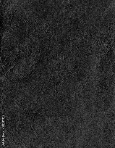 A piece of black leather, small grain, aged and wrinkled. Can be used as a template or as a background.
