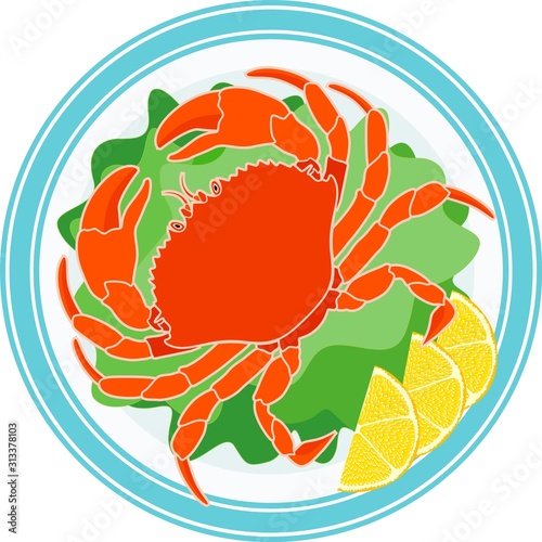 Cooked crab, green salad and lemon on a plate
