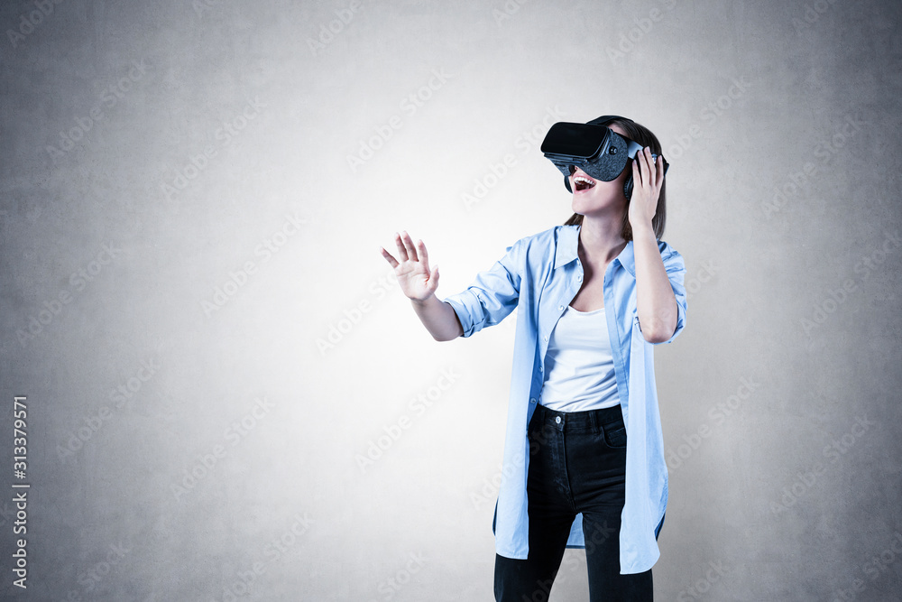 Happy casual girl gesturing in VR glasses, mock up Happy casual girl gesturing in VR glasses, mock up