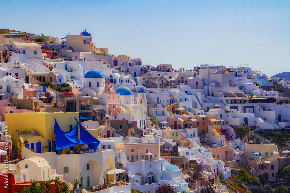 Blue and white colours of Oia City. Magnificent panorama of the island of Santorini Greece during a beautiful sunset in the Mediterranean. Love and travel background