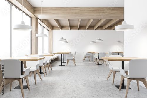 White loft cafe interior with square tables