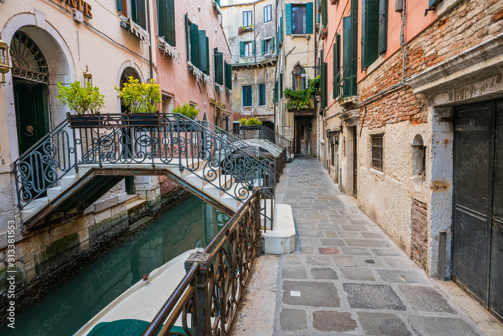 Street and canal in Venice, Italy