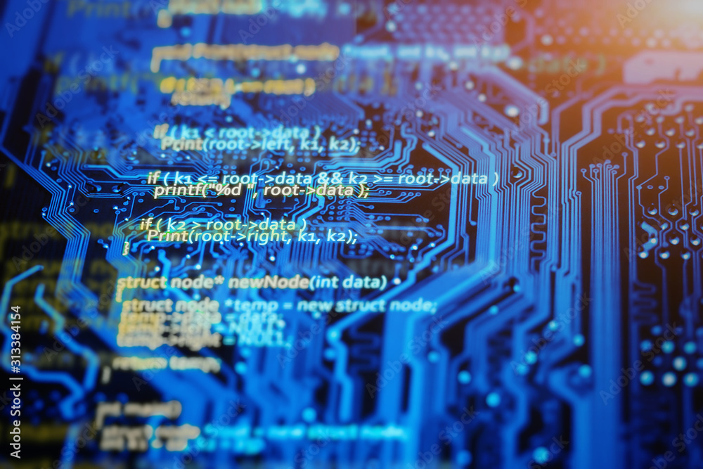 Foto De Programming Language Code On Blue Integrated Circuit Background foto-de-programming-language-code-on-blue-integrated-circuit-background