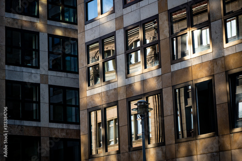 sun shining on facade of modern building