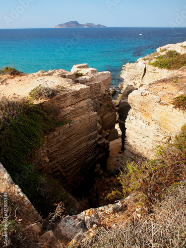 The Island of Favignana or La Farfalla in Mediterranean sea: Egadi Islands, coast of Trapani with crystalline azure waters of bays - Cala Rossa. Italy, Sicily photo