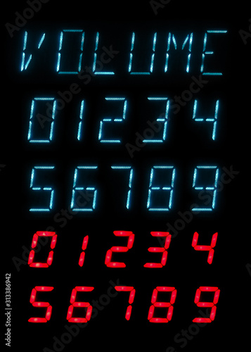 The inscription Volume and a set of green and red glowing lamp numbers on a black background