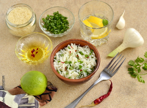 Basmati rice with lime, cilantro and garlic in ceramic bowls
