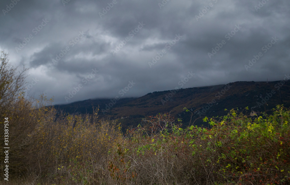 view of a stormy sky in the mountains