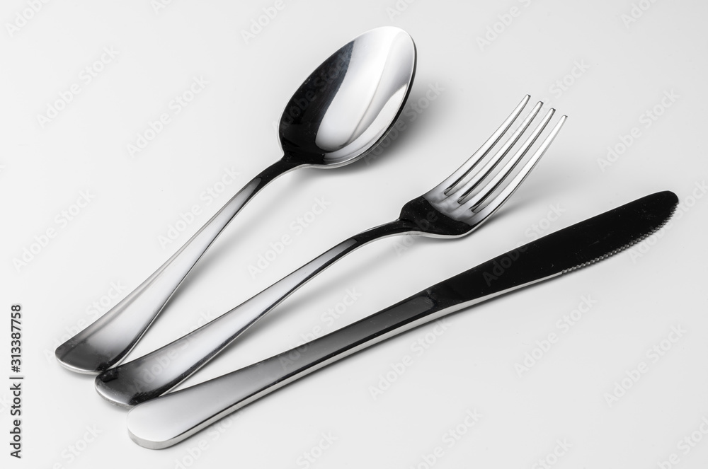 Spoon, fork and knife on a white background Spoon, fork and knife on a white background