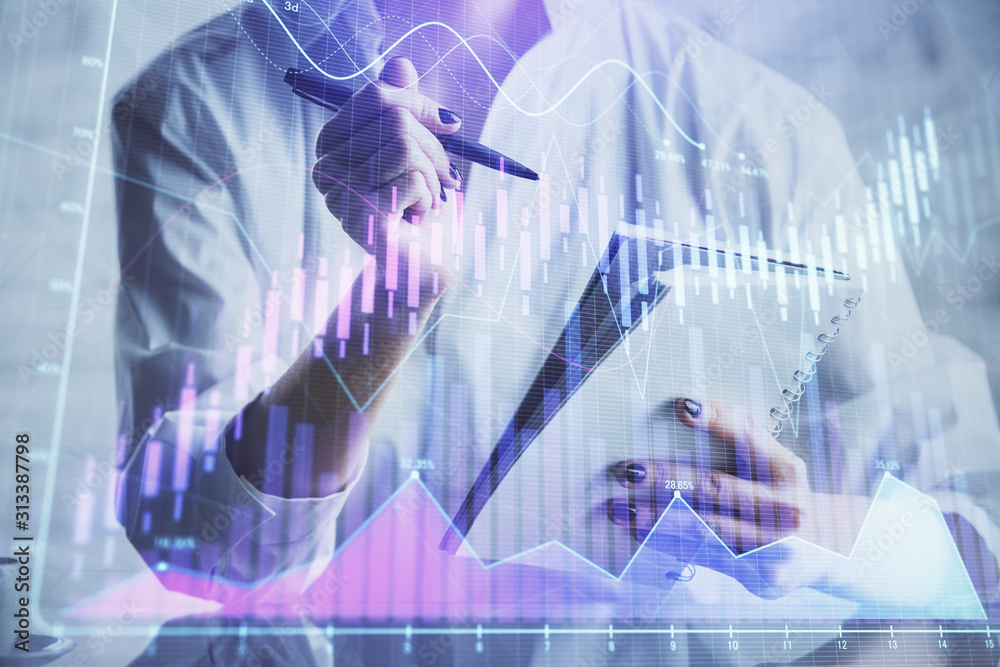 Financial chart drawn over hands taking notes background. Concept of research. Multi exposure