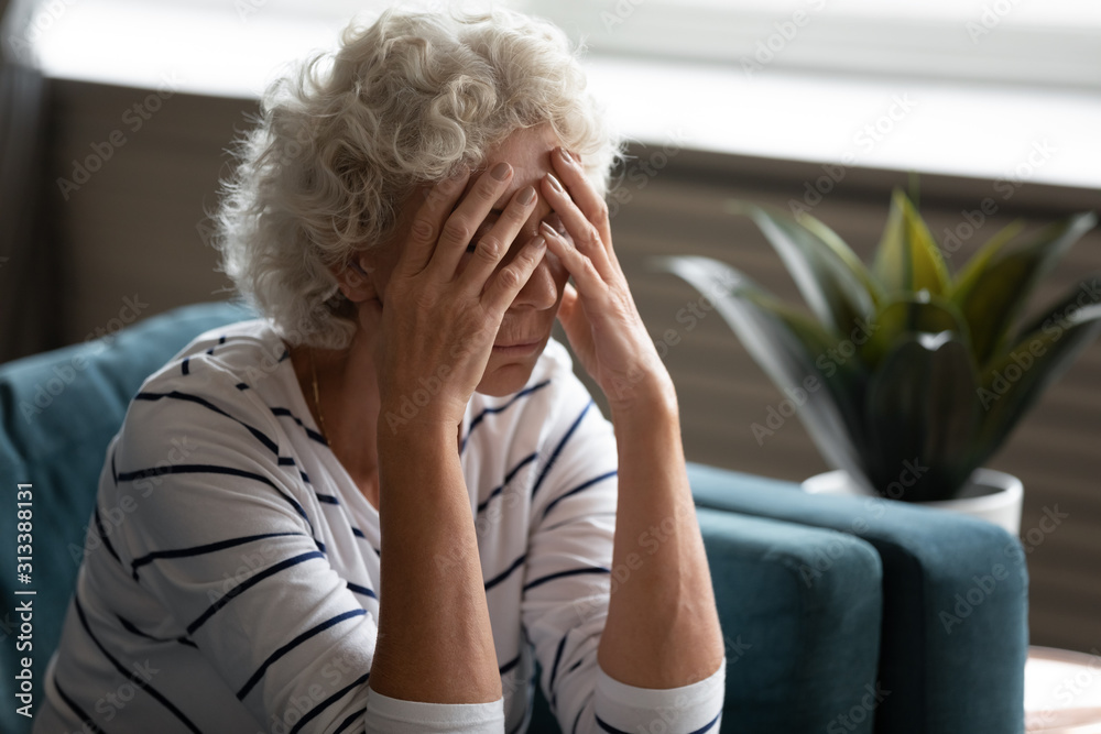 Elderly woman covered face with hands crying feels desperate Elderly woman covered face with hands crying feels desperate