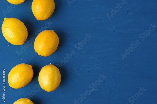 Lemon on classic blue background, top view