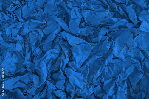 Crumpled classic blue fabric as a background