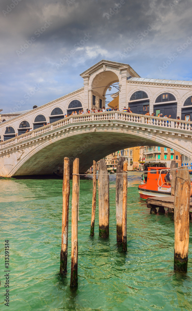 Rialto bridge and Grand Canal in Venice, Italy. The Rialto Bridge (Ponte di Rialto), the oldest of the four bridges spanning the Grand Canal in Venice, Italy.